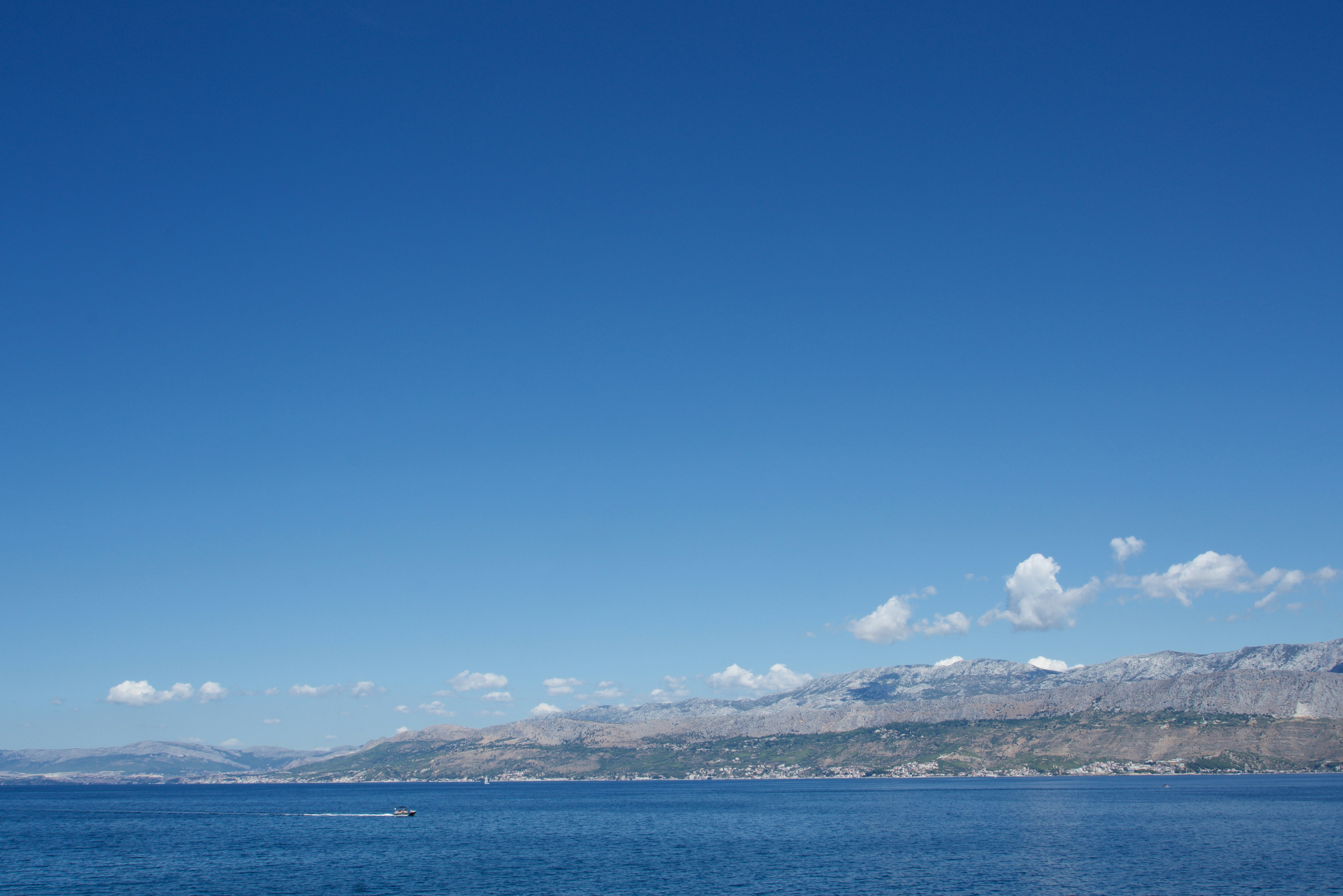 blue sea under blue sky during daytime